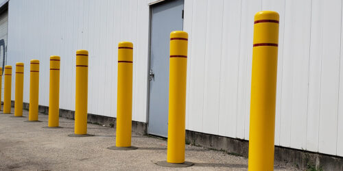 bollard covers in yellow with red strip for added visibility